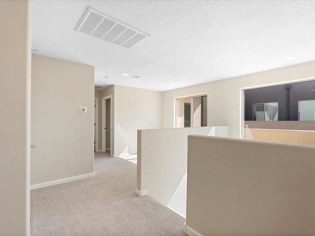5220 Gold Hill Ln, Santa Fe, NM 87507 - hallway featuring an upstairs landing, carpet floors, and baseboards