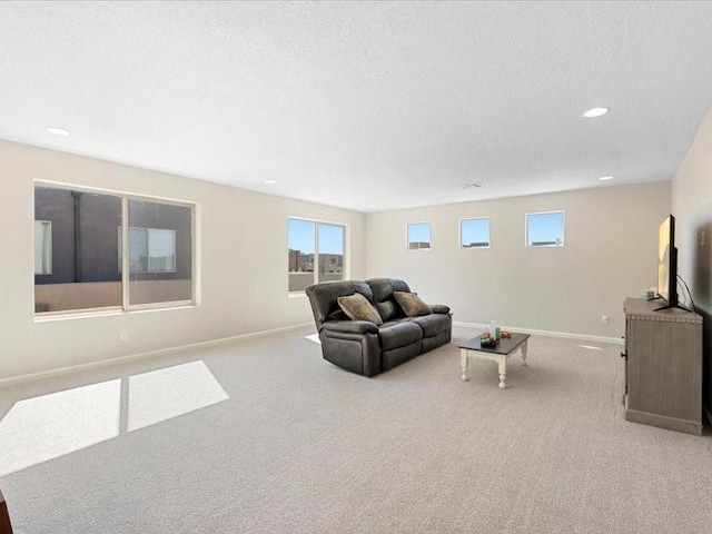5220 Gold Hill Ln, Santa Fe, NM 87507 - carpeted living area with baseboards, a textured ceiling, plenty of natural light, and recessed lighting
