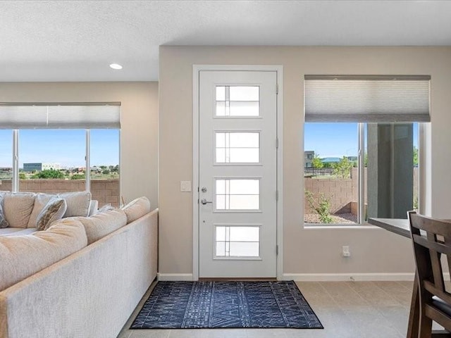 5220 Gold Hill Ln, Santa Fe, NM 87507 - tiled entrance foyer featuring plenty of natural light, baseboards, and recessed lighting