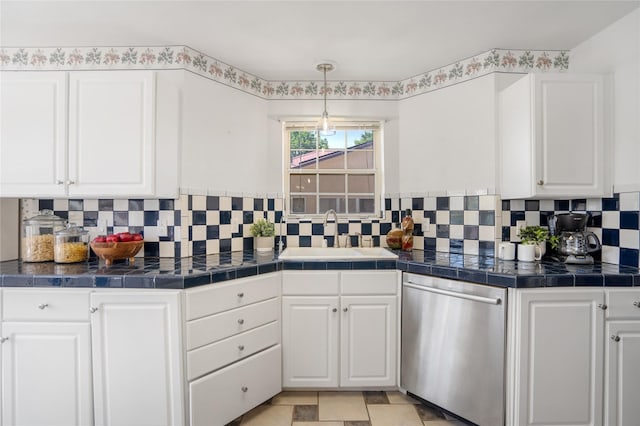917 Estates Dr, Los Alamos, NM 87544 - kitchen with dishwasher, a sink, white cabinetry, and backsplash