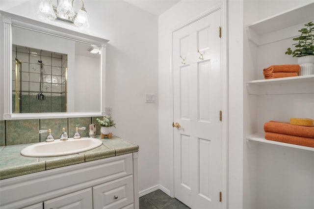 917 Estates Dr, Los Alamos, NM 87544 - bathroom featuring vanity, a tile shower, and tile patterned floors