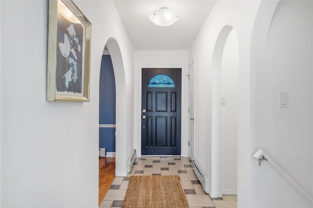 917 Estates Dr, Los Alamos, NM 87544 - entryway with a baseboard heating unit, arched walkways, baseboard heating, and baseboards