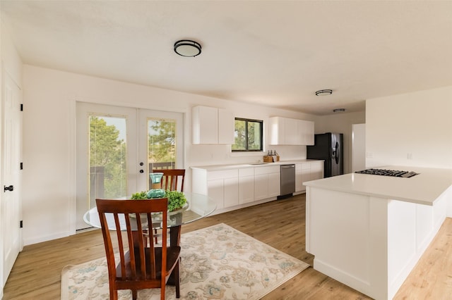 1180 Sioux, Los Alamos, NM 87544 - dining room featuring light wood finished floors, french doors, and baseboards
