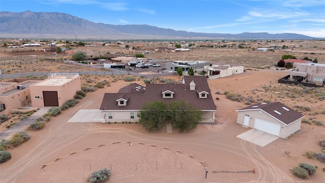 1810 Eucalyptus Rd NE, Rio Rancho, NM 87144 - aerial view of property and surrounding area featuring a mountainous background and a desert landscape
