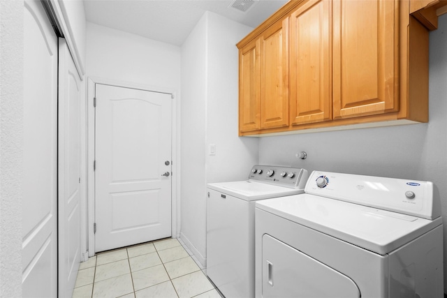 1810 Eucalyptus Rd NE, Rio Rancho, NM 87144 - laundry area with cabinet space, washer and dryer, and light tile patterned floors