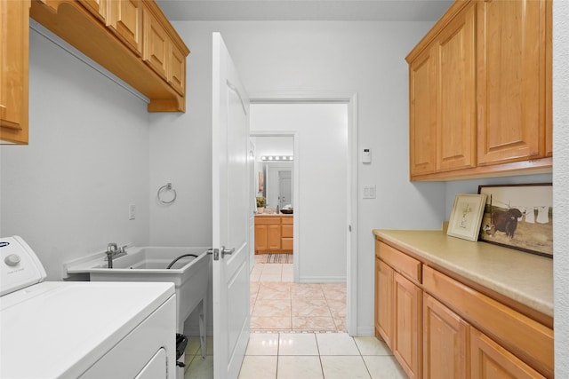 1810 Eucalyptus Rd NE, Rio Rancho, NM 87144 - laundry area featuring washer / clothes dryer, cabinet space, and light tile patterned floors