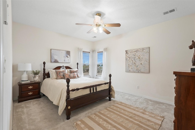 1810 Eucalyptus Rd NE, Rio Rancho, NM 87144 - bedroom with light colored carpet, baseboards, and a ceiling fan