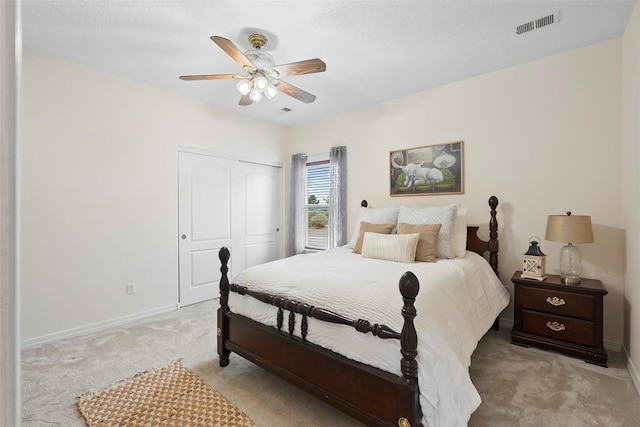 1810 Eucalyptus Rd NE, Rio Rancho, NM 87144 - bedroom with light carpet, a closet, baseboards, and ceiling fan