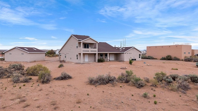 1810 Eucalyptus Rd NE, Rio Rancho, NM 87144 - view of front facade with stucco siding and a balcony