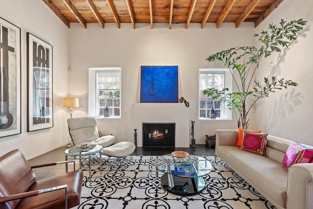 519 E Palace Ave, Santa Fe, NM 87501 - living area featuring wooden ceiling with exposed beams and a lit fireplace