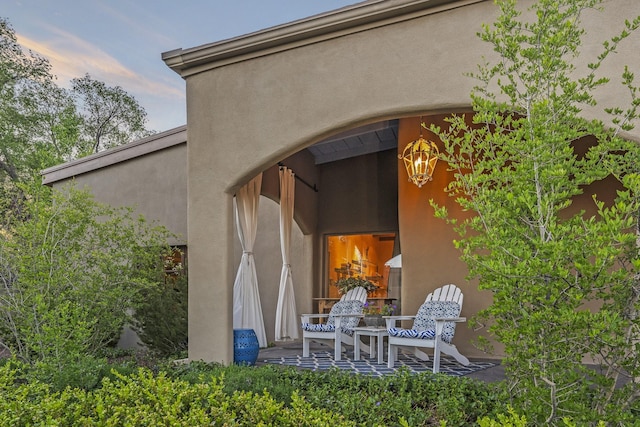 519 E Palace Ave, Santa Fe, NM 87501 - exterior entry at dusk with stucco siding