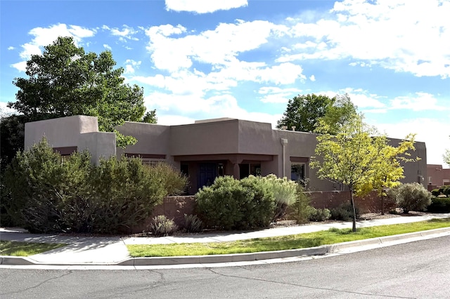 1 Pajarito Peak, Santa Fe, NM 87508 - pueblo-style home with stucco siding