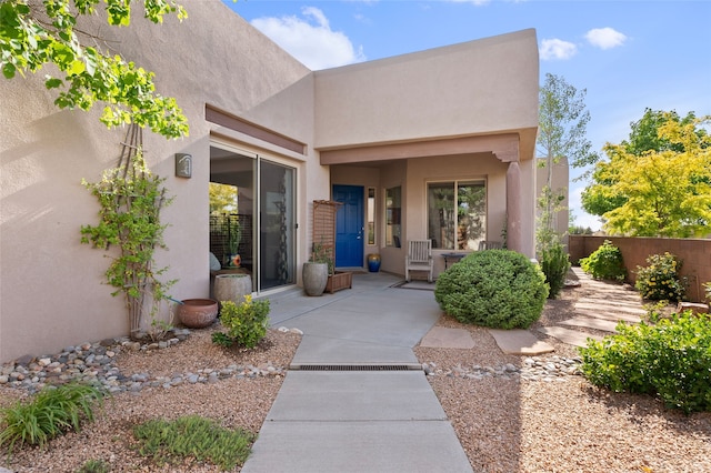 1 Pajarito Peak, Santa Fe, NM 87508 - doorway to property with stucco siding and a patio area