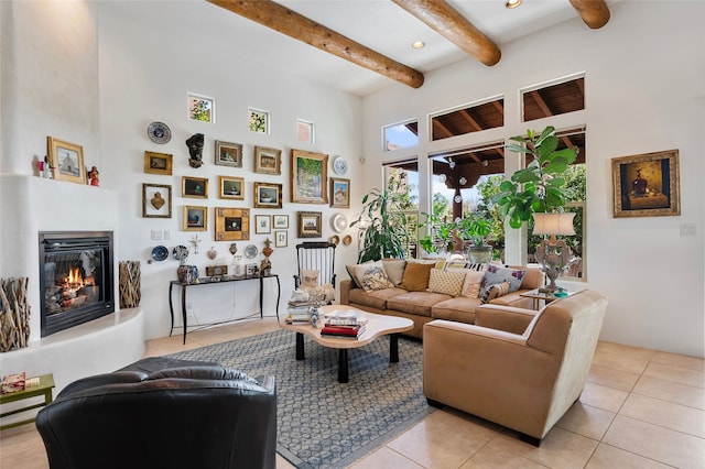 1 Pajarito Peak, Santa Fe, NM 87508 - living room featuring a towering ceiling, light tile patterned floors, beamed ceiling, a glass covered fireplace, and recessed lighting