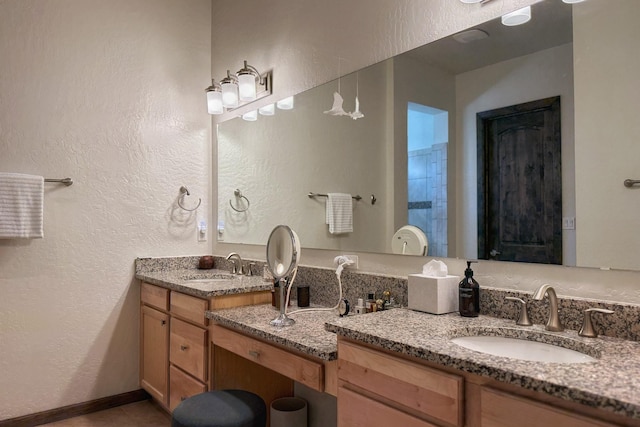 9 Camino Maravilla, Santa Fe, NM 87506 - bathroom with double vanity and a textured wall