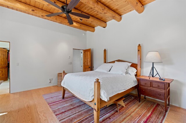 557 Valle Chamiso Ln, Santa Fe, NM 87505 - bedroom featuring wooden ceiling with exposed beams, light wood finished floors, and ceiling fan