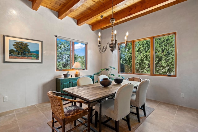 557 Valle Chamiso Ln, Santa Fe, NM 87505 - dining room with wooden ceiling with exposed beams, light tile patterned floors, and a chandelier