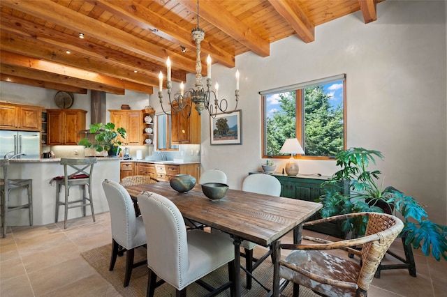 557 Valle Chamiso Ln, Santa Fe, NM 87505 - dining area with a chandelier and wooden ceiling with exposed beams