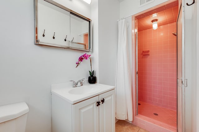 202 Alamo Dr, Santa Fe, NM 87501 - bathroom with vanity, a shower stall, toilet, and tile patterned floors