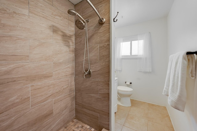 202 Alamo Dr, Santa Fe, NM 87501 - bathroom featuring a tile shower, toilet, and tile patterned flooring