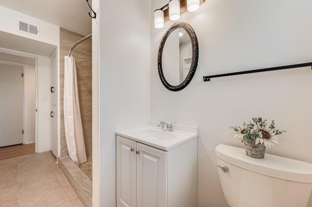 202 Alamo Dr, Santa Fe, NM 87501 - bathroom with toilet, vanity, and a shower with curtain