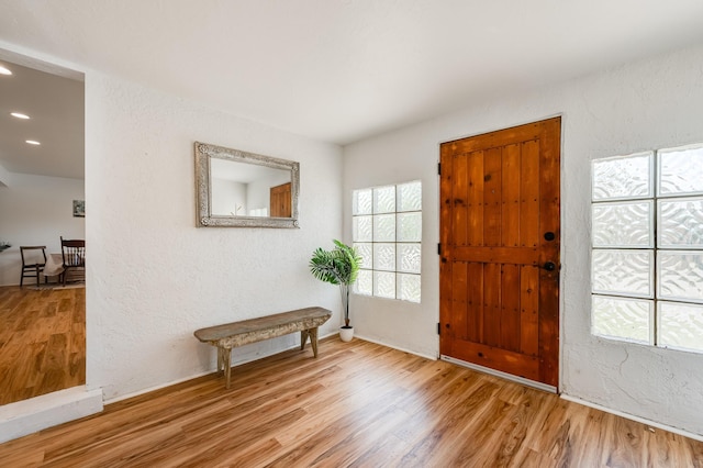 202 Alamo Dr, Santa Fe, NM 87501 - entryway with wood finished floors, healthy amount of natural light, recessed lighting, a textured wall, and baseboards