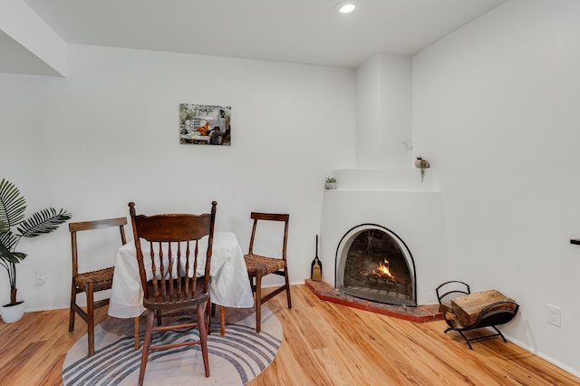 202 Alamo Dr, Santa Fe, NM 87501 - living area featuring wood finished floors, recessed lighting, a lit fireplace, and baseboards