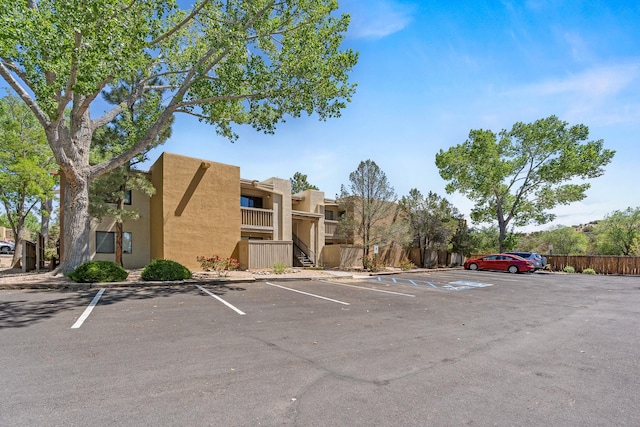 941 Calle Mejia Unit 1610, Santa Fe, NM 87501 - view of building exterior with uncovered parking