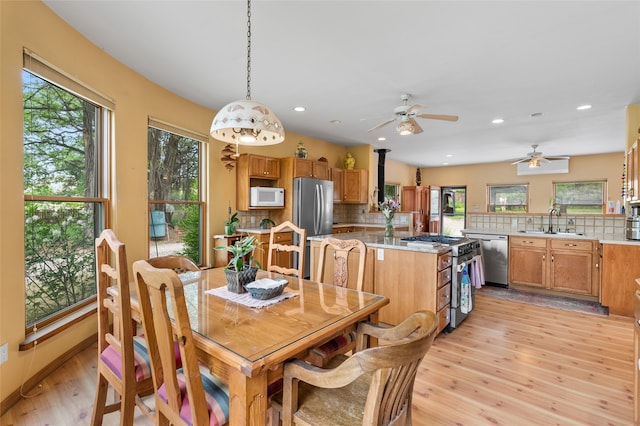 65 E Sombrillo Rd, Nm, NM 87532 - dining area with light wood finished floors, plenty of natural light, ceiling fan, and recessed lighting