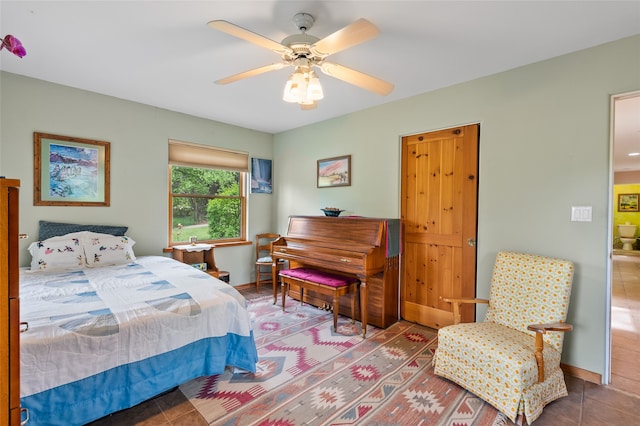 65 E Sombrillo Rd, Nm, NM 87532 - tiled bedroom with a ceiling fan and baseboards