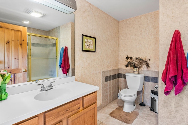 65 E Sombrillo Rd, Nm, NM 87532 - bathroom featuring vanity, tile patterned floors, a shower with shower door, and toilet