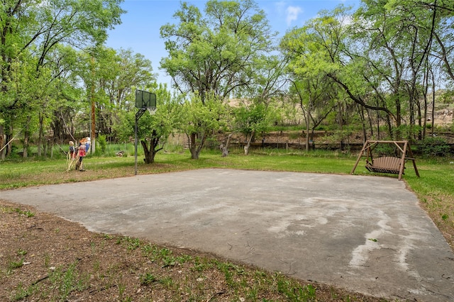 65 E Sombrillo Rd, Nm, NM 87532 - view of patio featuring basketball hoop