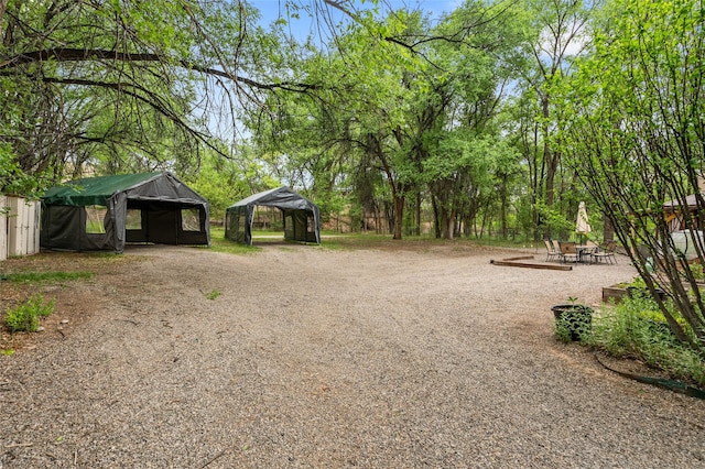 65 E Sombrillo Rd, Nm, NM 87532 - view of yard featuring a detached carport