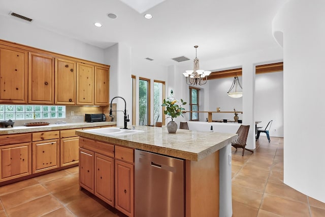 138 E Chili Line, Santa Fe, NM 87508 - kitchen with dishwasher, a sink, tile counters, a chandelier, and an island with sink