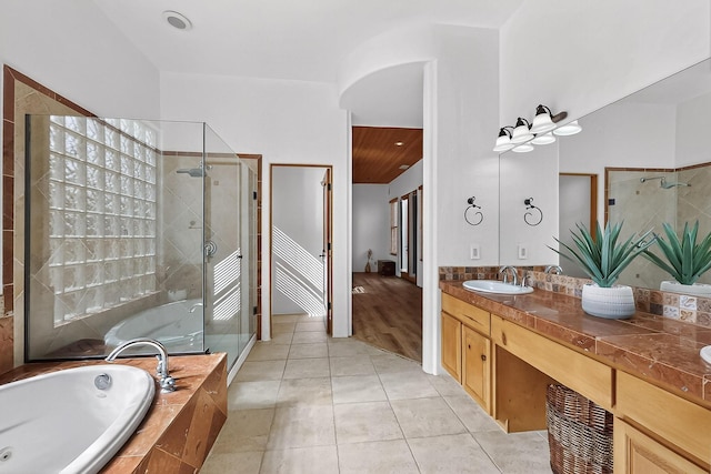138 E Chili Line, Santa Fe, NM 87508 - bathroom featuring a shower stall, a bath, tile patterned floors, and double vanity