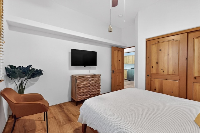138 E Chili Line, Santa Fe, NM 87508 - bedroom with light wood-style flooring, a closet, ceiling fan, and a high ceiling