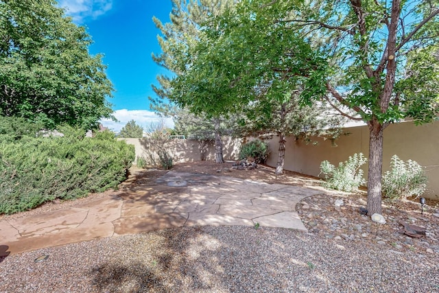 138 E Chili Line, Santa Fe, NM 87508 - fenced backyard with a patio