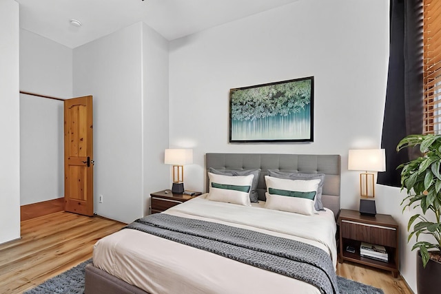 138 E Chili Line, Santa Fe, NM 87508 - bedroom featuring wood finished floors