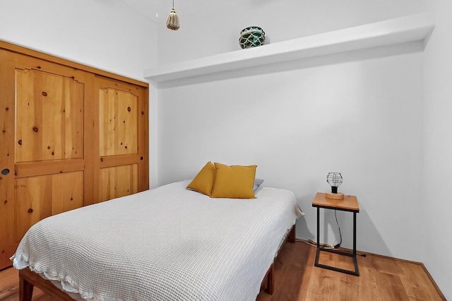 138 E Chili Line, Santa Fe, NM 87508 - bedroom featuring wood finished floors and baseboards