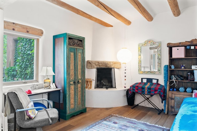525 Camino Militar, Santa Fe, NM 87501 - bedroom with wood finished floors and beamed ceiling