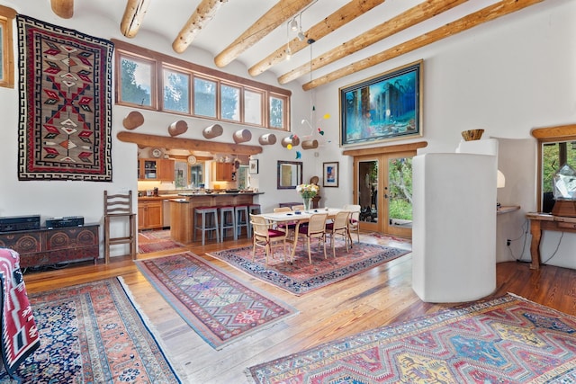 525 Camino Militar, Santa Fe, NM 87501 - dining area featuring a high ceiling, beamed ceiling, light wood-type flooring, and french doors