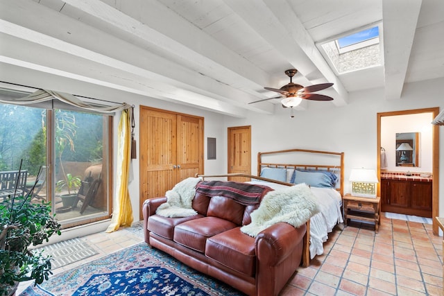 525 Camino Militar, Santa Fe, NM 87501 - bedroom featuring a skylight, beam ceiling, light tile patterned flooring, and access to outside
