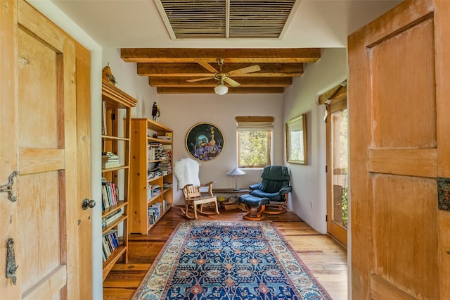 525 Camino Militar, Santa Fe, NM 87501 - living area with beam ceiling, hardwood / wood-style floors, and ceiling fan