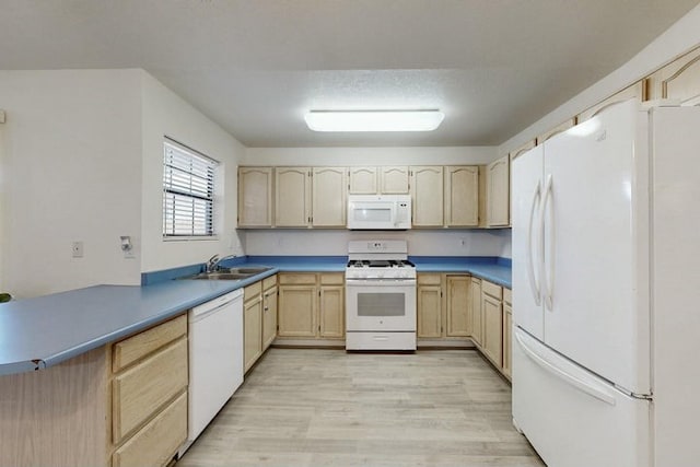 1128 Pandora Dr SW, Los Lunas, NM 87031 - kitchen featuring white appliances, light brown cabinets, and light wood finished floors