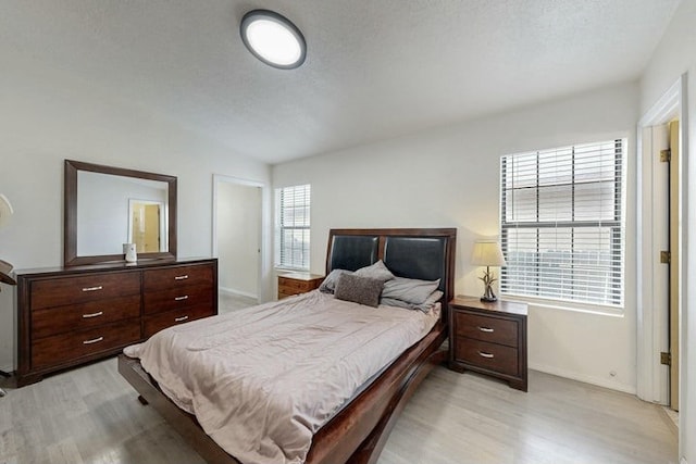 1128 Pandora Dr SW, Los Lunas, NM 87031 - bedroom with light wood-style flooring