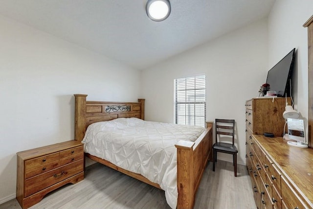 1128 Pandora Dr SW, Los Lunas, NM 87031 - bedroom featuring lofted ceiling and light wood-style floors