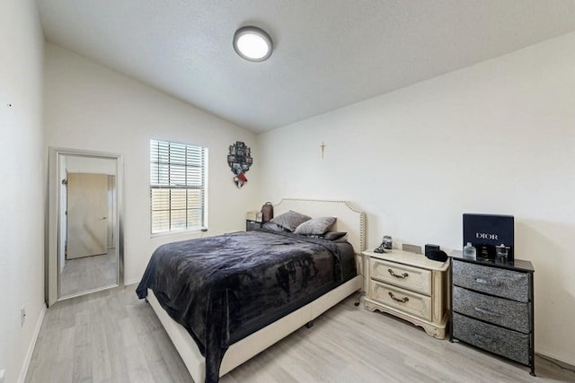 1128 Pandora Dr SW, Los Lunas, NM 87031 - bedroom featuring lofted ceiling and light wood-style floors