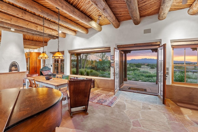26 Camino Los Angelitos, Santa Fe, NM 87540 - home office featuring wooden ceiling with exposed beams and stone flooring