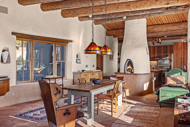 26 Camino Los Angelitos, Santa Fe, NM 87540 - dining room featuring a high ceiling and wood ceiling with exposed beams