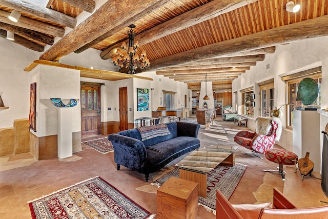 26 Camino Los Angelitos, Santa Fe, NM 87540 - living area with wood ceiling with exposed beams, a chandelier, and carpet flooring